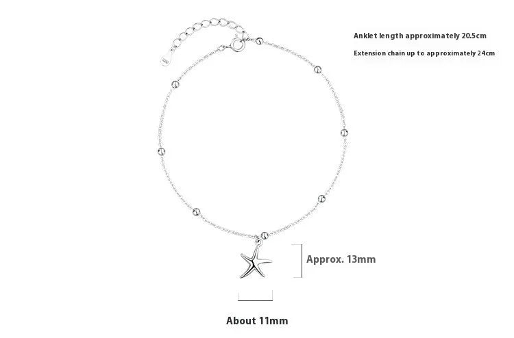 Close-up of a sterling silver starfish charm anklet with a round beaded chain.