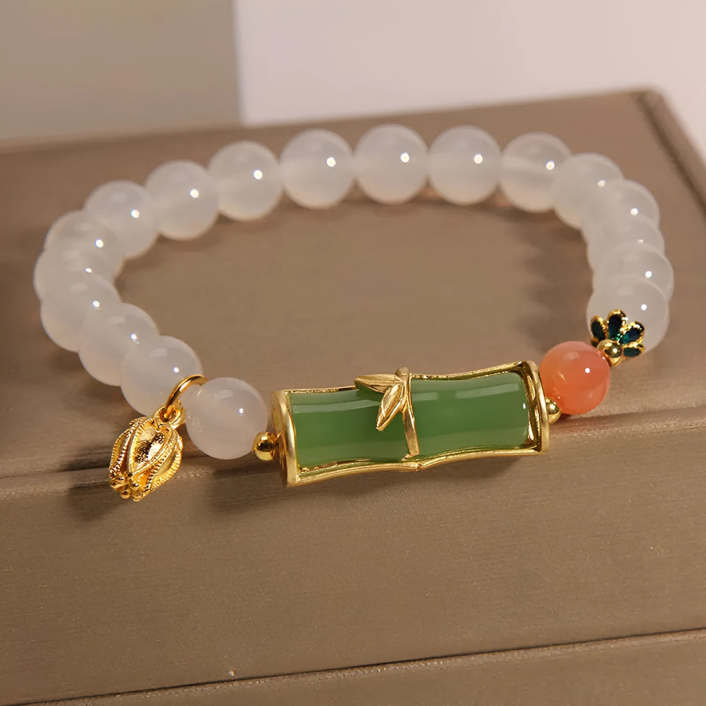 Women's white agate jade bead bracelet with bamboo joint beading in a retro Chinese style.