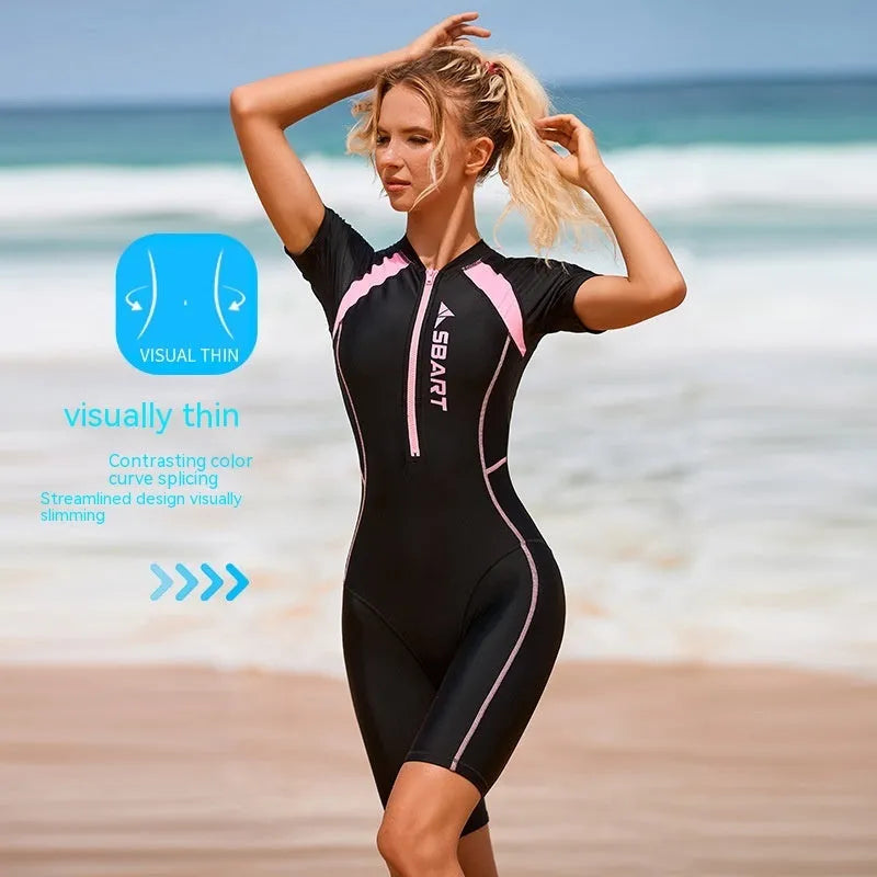 Solid colour women's one-piece surfing swimsuit with short sleeves and a chest pad.