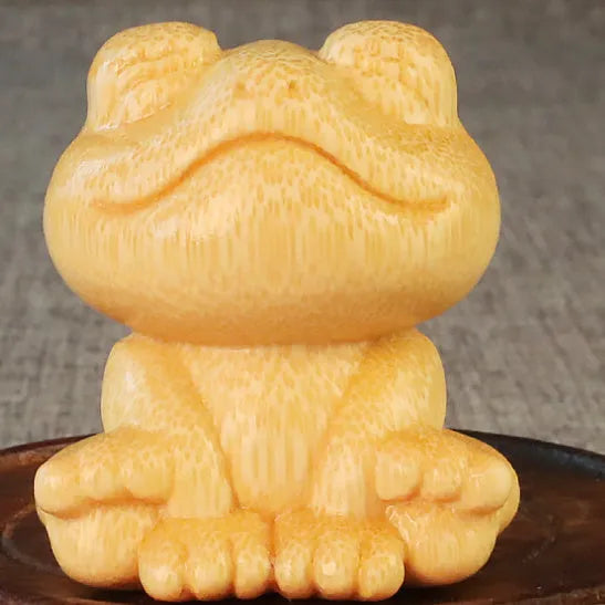 Solid bamboo carving ornament with smiling frog design measuring 5cm tall