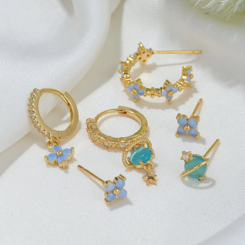 Gold and silver flower nail design ear studs with zircon mosaic accents in Japanese Korean style