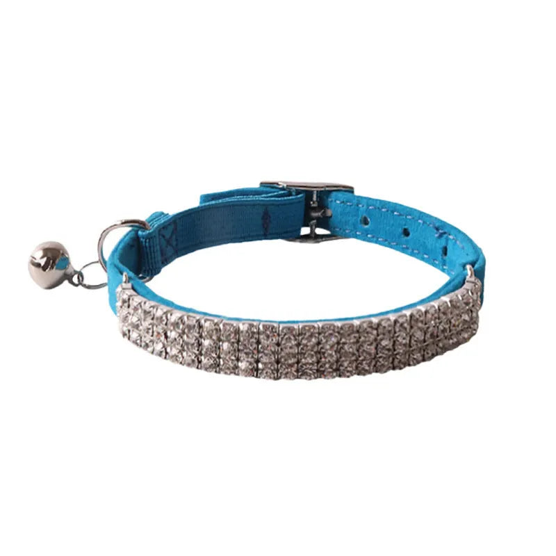 Soft flocking elastic buckle cat collar in multiple colours on a white background.