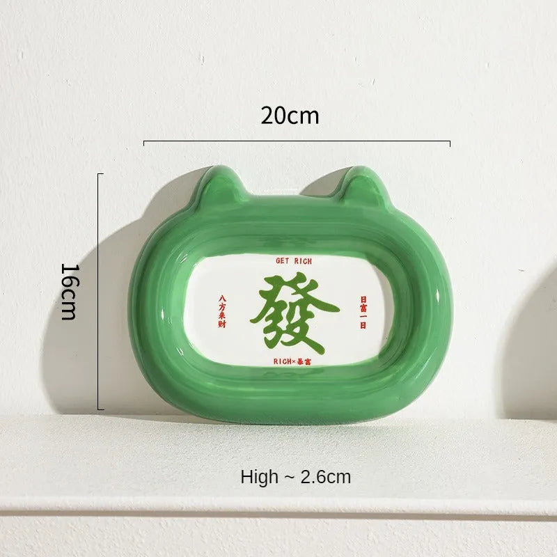 Ceramic pet bowl sculpted like an animal with a slanted interior for food, shown in a choice of colours.