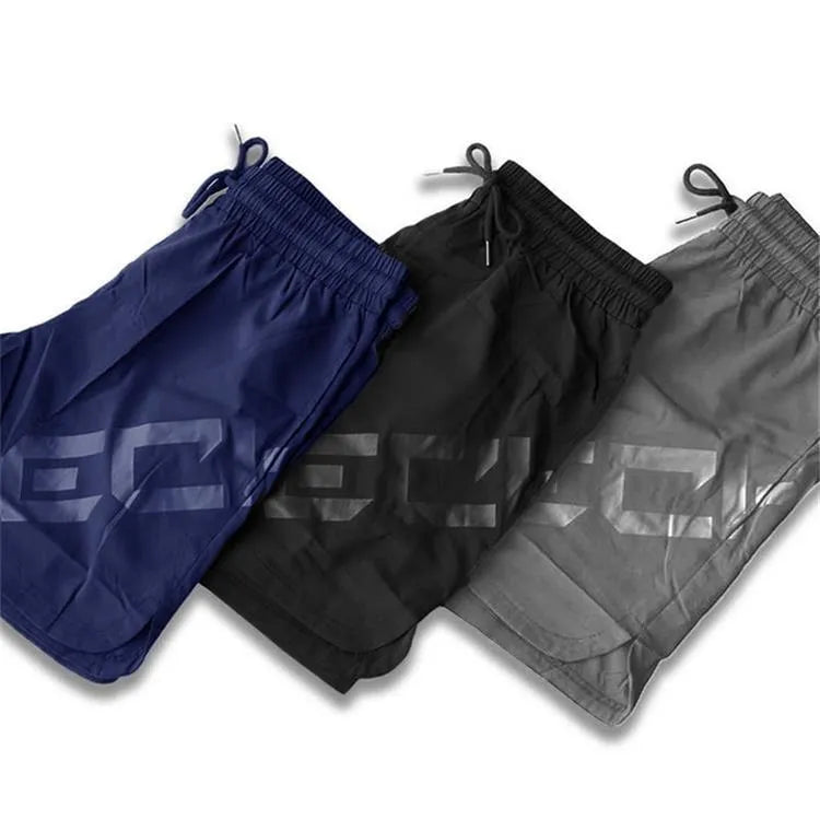 Men's black elastic quick-dry running shorts with mid waist and knee-length leg.