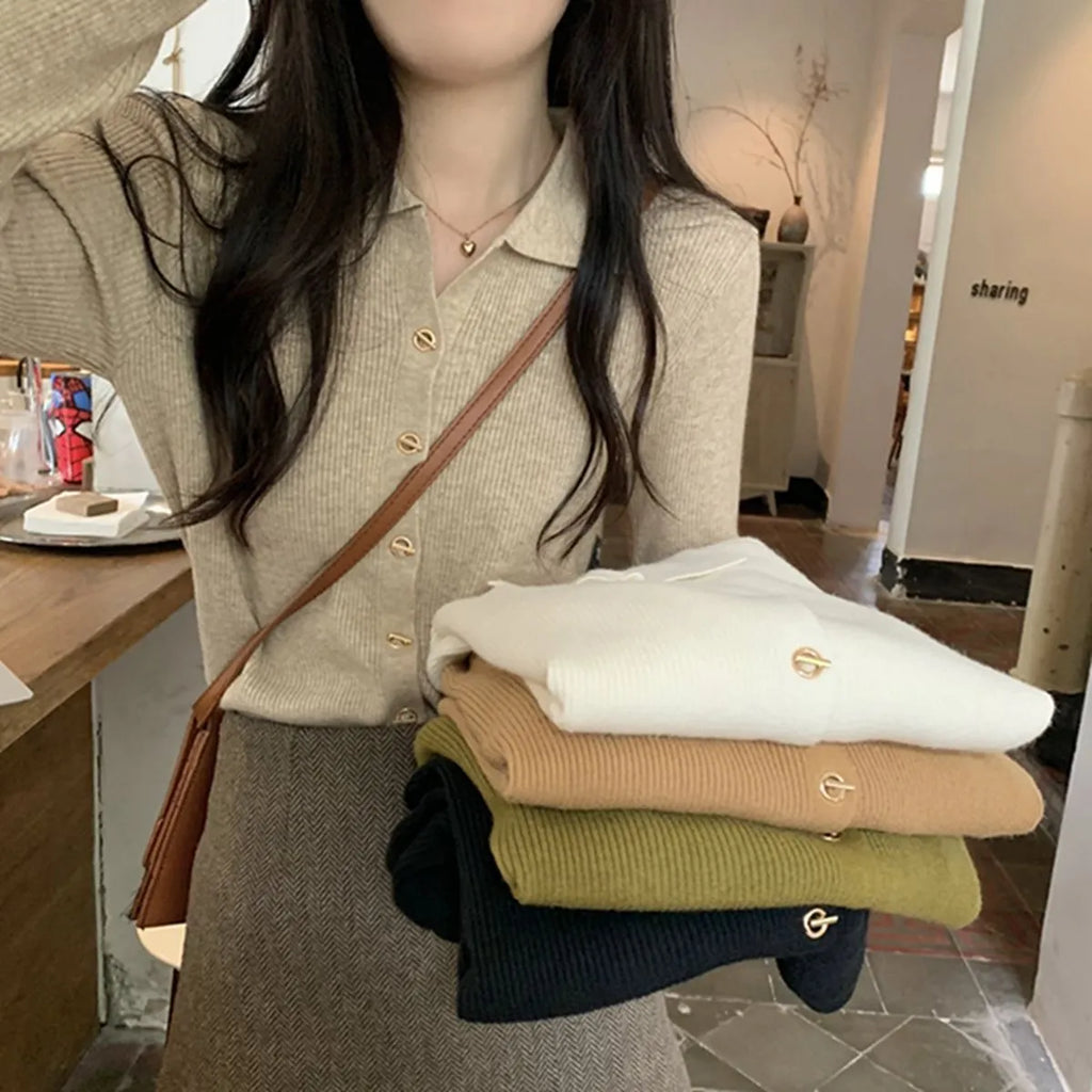 Long-sleeved beige viscose knitted cardigan top shown loose fit on a hanger