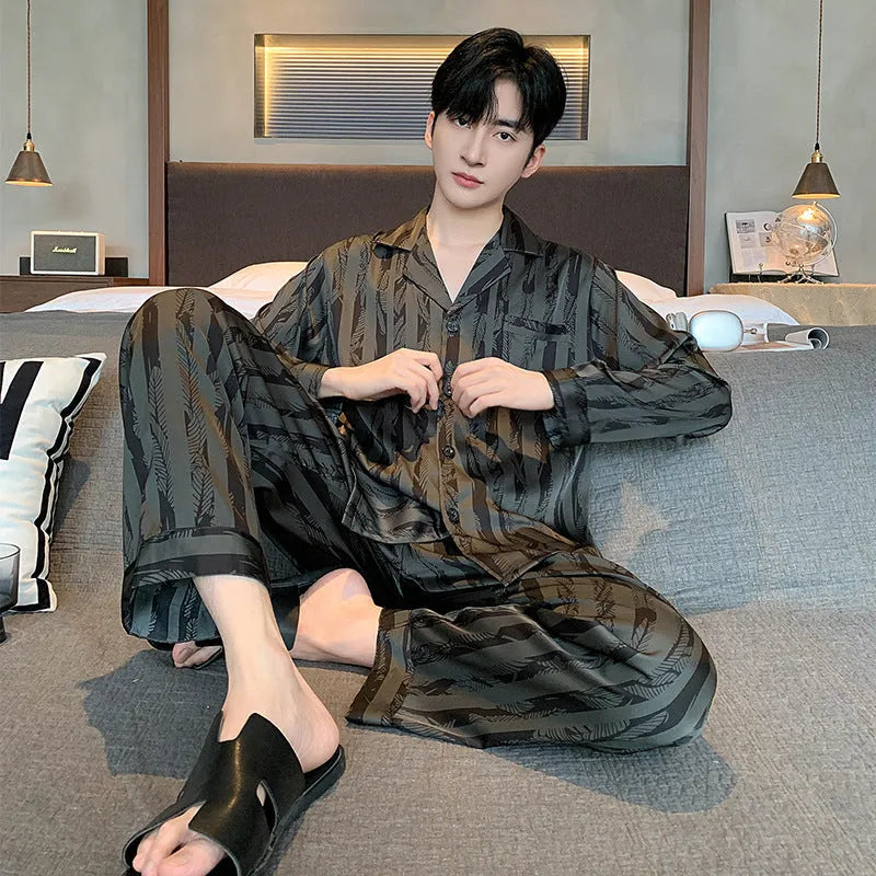 Black striped men's ice silk two-piece pajama set with V-neck top and long trousers.