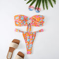Women's floral printed tube top ring bikini swimsuit showing backless design and briefs style