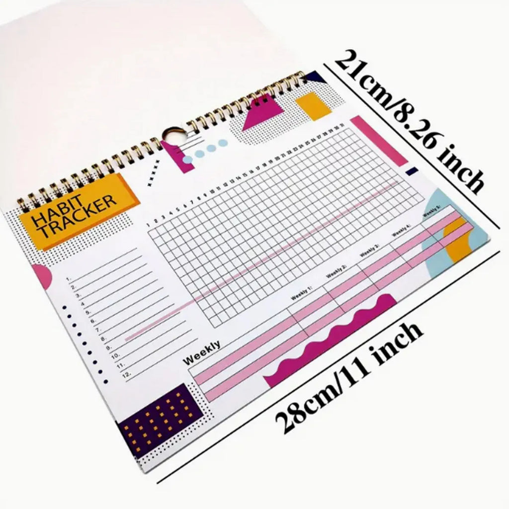 A4 habit tracking journal open showing 12 internal pages for schedule planning