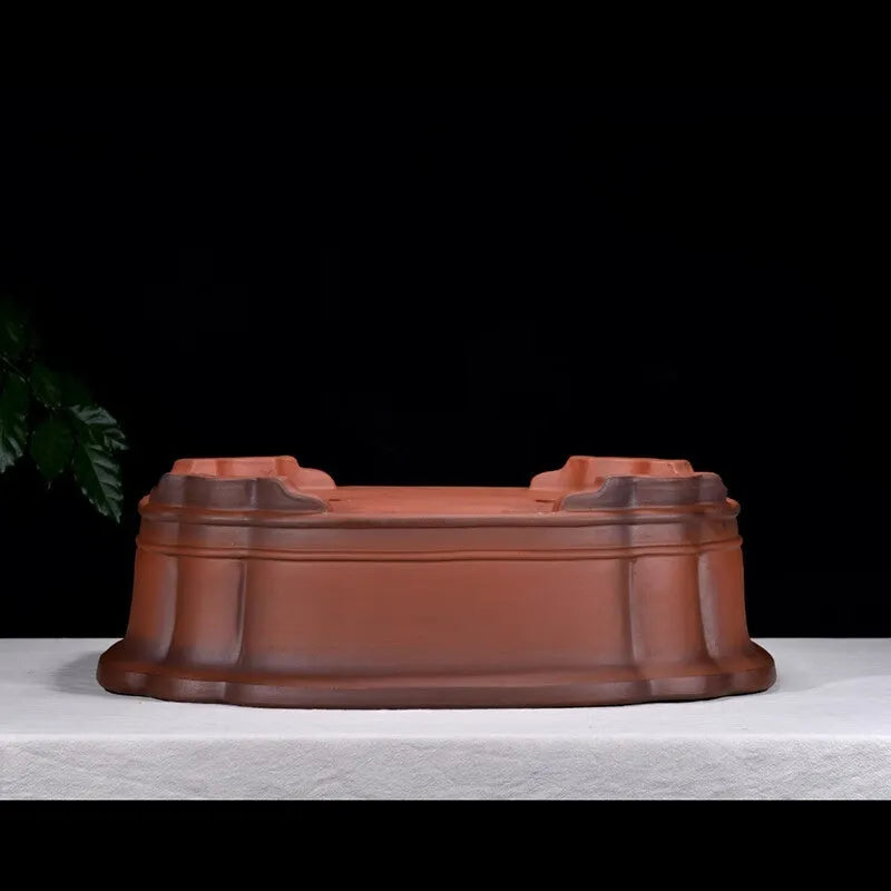 Chinese-style antique finish purple clay oval flowerpot measuring 71cm long by 54cm wide