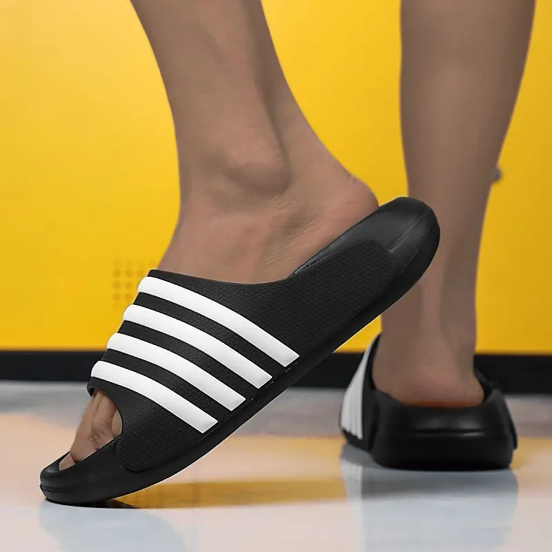 Casual unisex PVC and EVA slippers in beige, black and white, blue and white, and green colours.