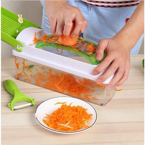 12-piece green manual vegetable chopper set with stainless steel blades on kitchen counter