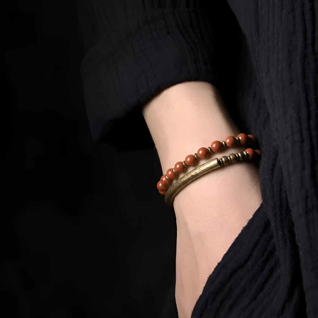 Layered ethnic bracelet for men and women in natural stone and brass, showing colour options.