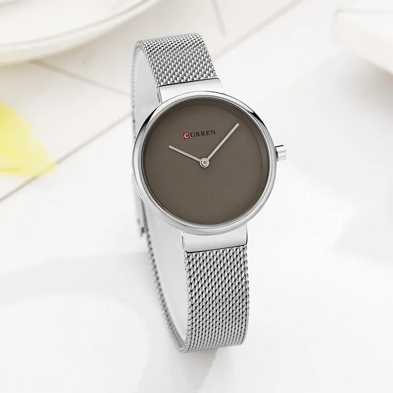 Women's quartz watch with stainless steel mesh belt and 7.8mm thin case, available in silver, gold or rose gold tone