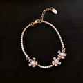 Women's gold copper bracelet with geometric design and inlaid zircon stones