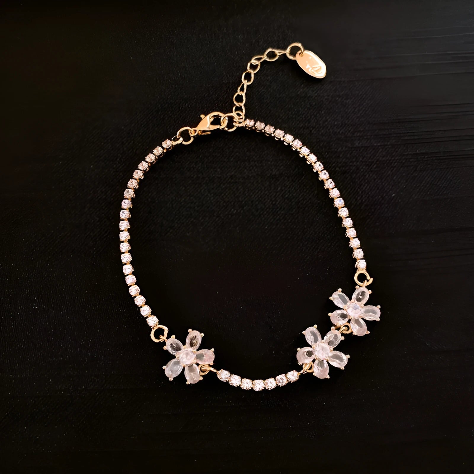 Women's gold copper bracelet with geometric design and inlaid zircon stones