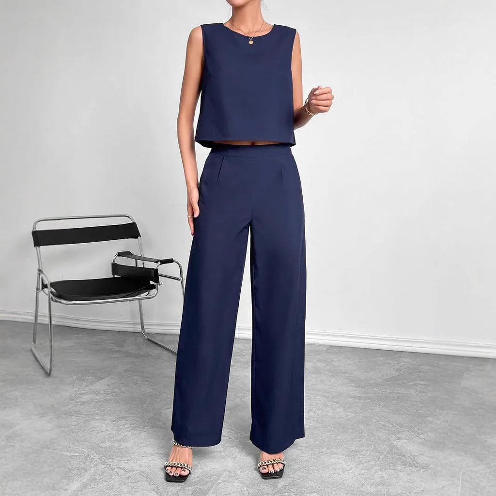 Red women's sleeveless top and wide leg pants two-piece co-ord set on a hanger.