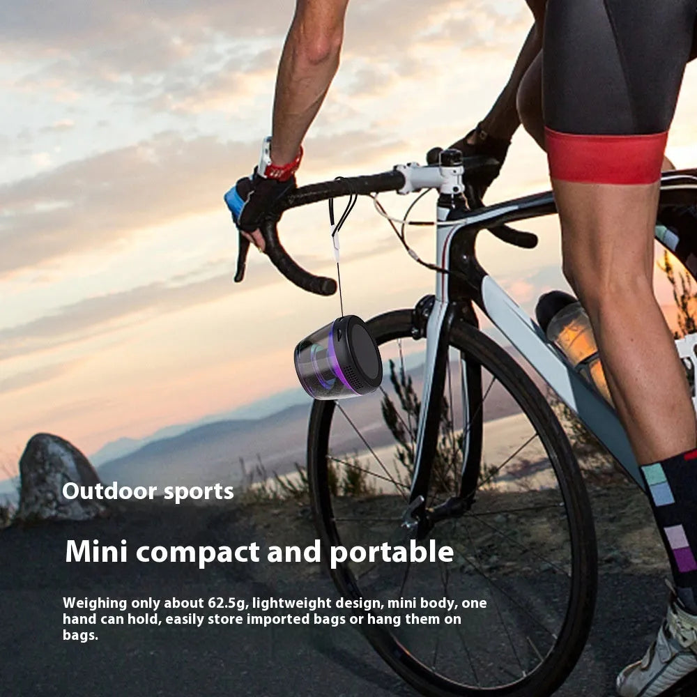 Portable wireless Bluetooth mini speaker with magnetic base and ambient lighting in black or white colour