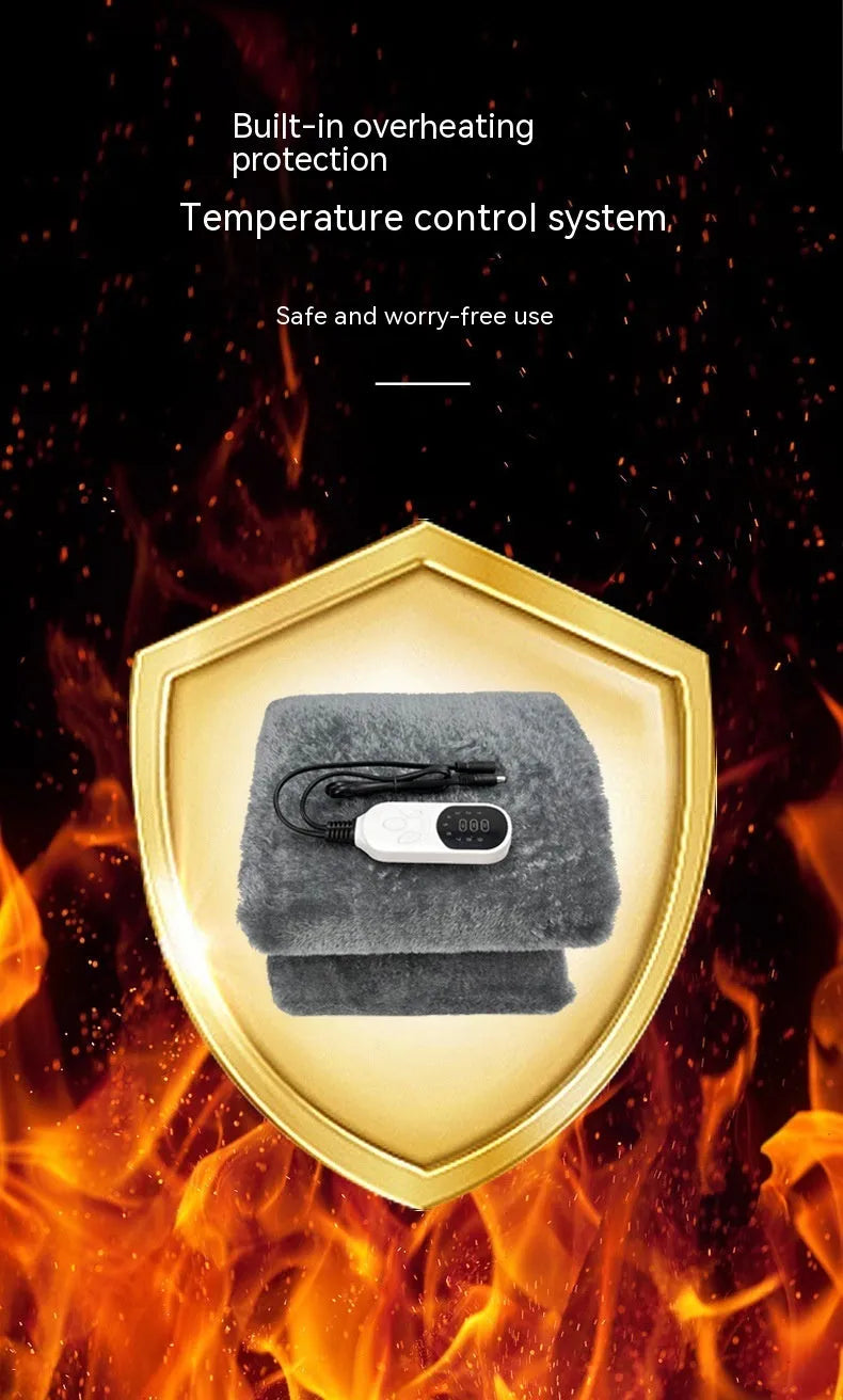 Grey 12V car electric blanket with digital controller, shown plugged into a car cigarette lighter socket.