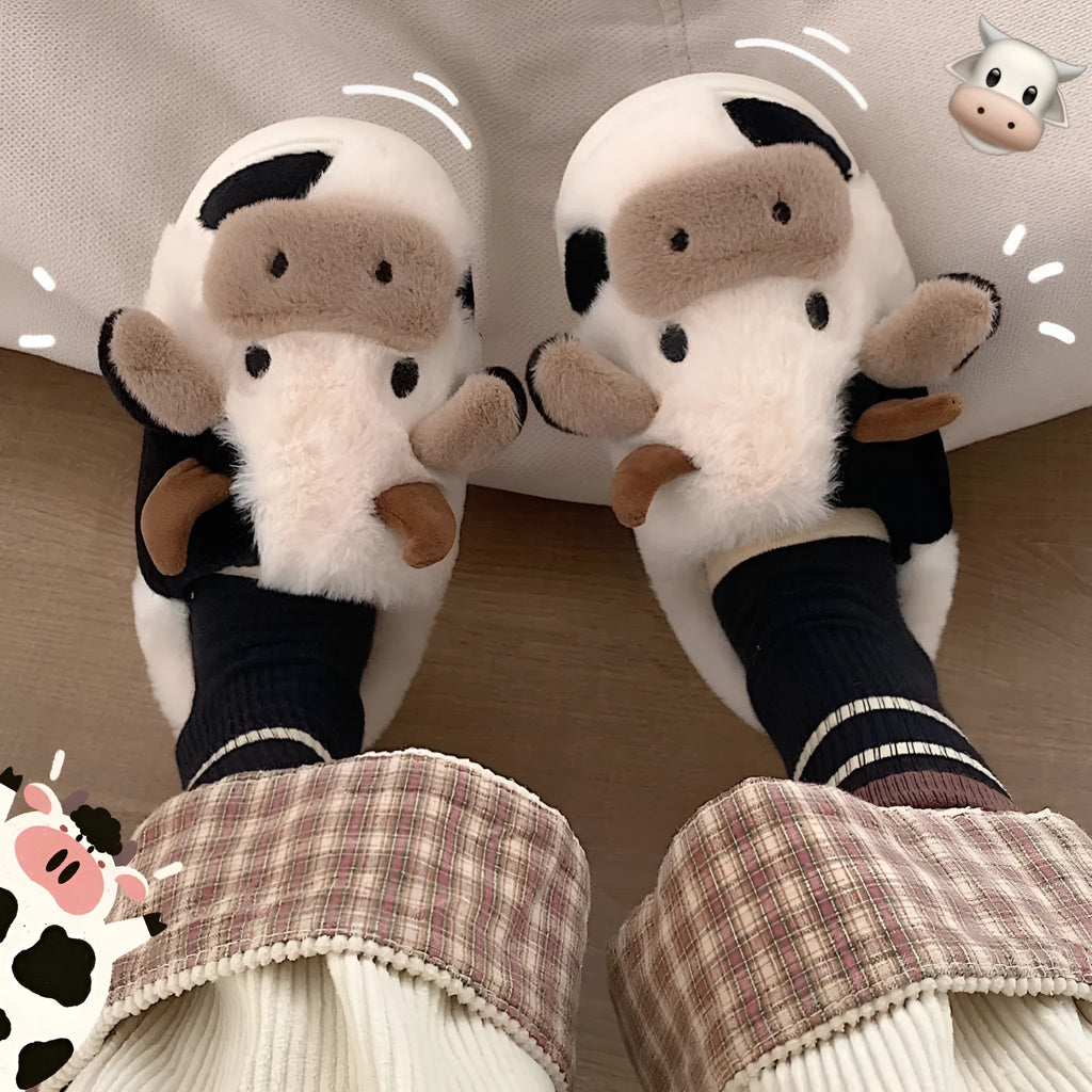 White cow animal house slippers with black spots, plush lining, and textured non-slip sole