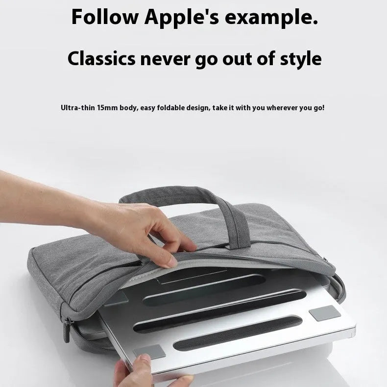 Silver aluminium alloy folding laptop cooling rack on a wooden desk.
