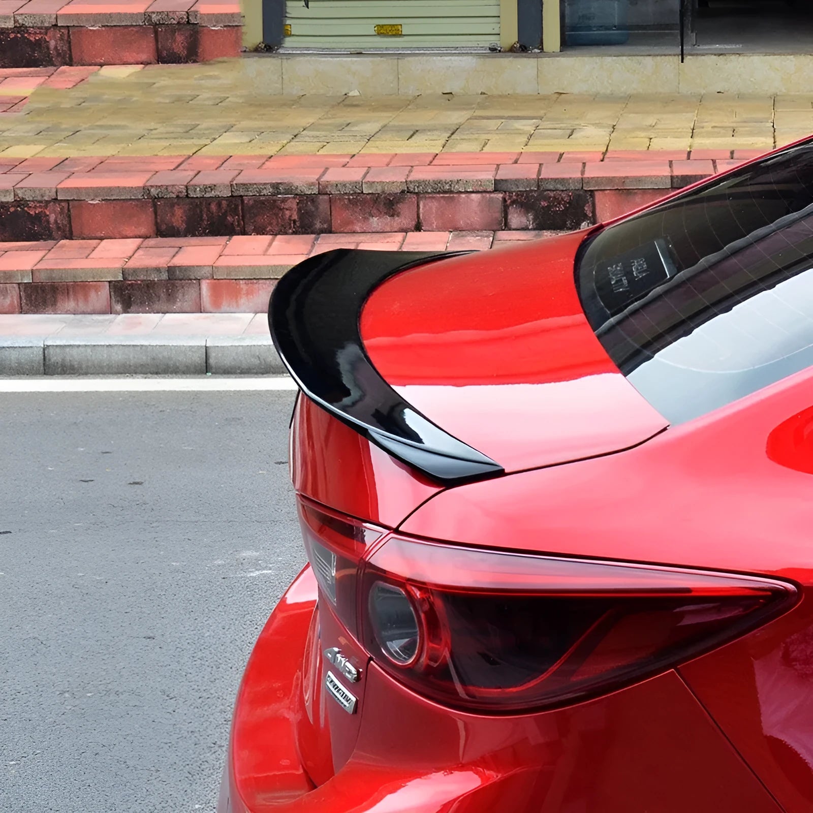 Bright black Mazda 3 modified tail trim for 2014-2021 Axela Exela models with large fixed wind surrounded design