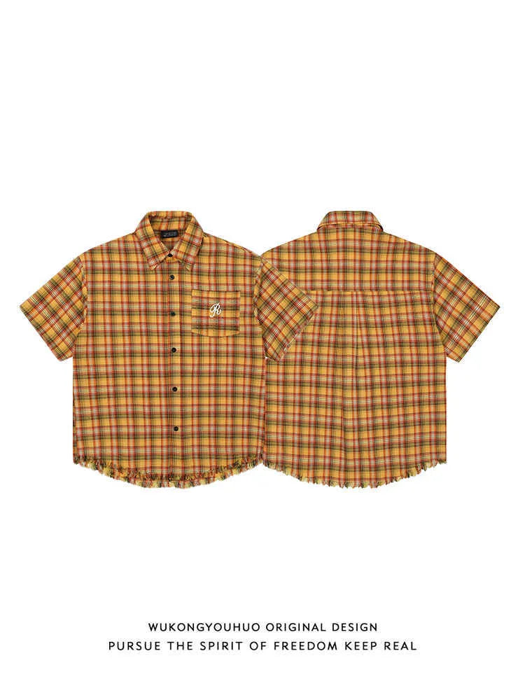 Yellow check plaid shirt with embroidered pocket detail on chest, short sleeves, loose fit casual style
