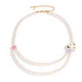 Enamel glaze diamond three-colour rose double-layer pearl necklace for women on display