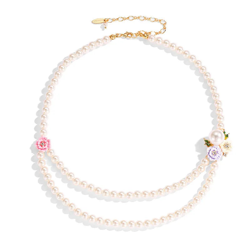 Enamel glaze diamond three-colour rose double-layer pearl necklace for women on display