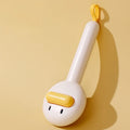 Yellow plastic pet grooming comb with open-section needle teeth for removing hair from cats and dogs.