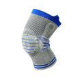 Cotton knee pad with silicone massage spring bar shock absorber in a black and blue colour combination.