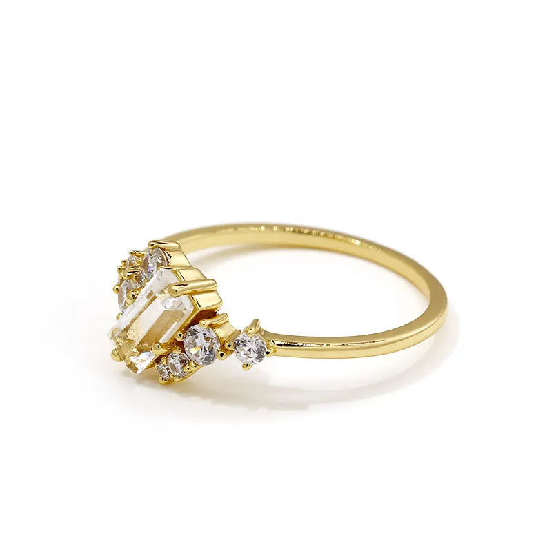White crystal shiny electroplated silver women's ring on a white background