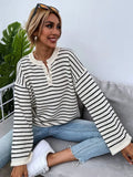 Black striped women's casual top with drop shoulders and button details on viscose knit fabric