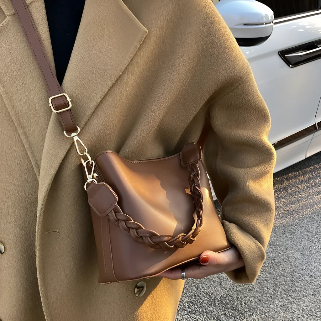 Retro unisex woven PU crossbody bucket bag shown in khaki colour.