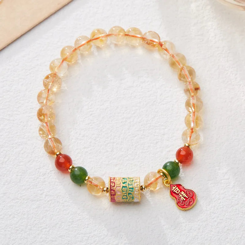Hand-woven citrine crystal bracelet with 6mm geometric beads on a wrist