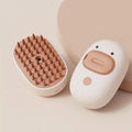 White or yellow rechargeable pet steam brush for grooming dogs and cats.