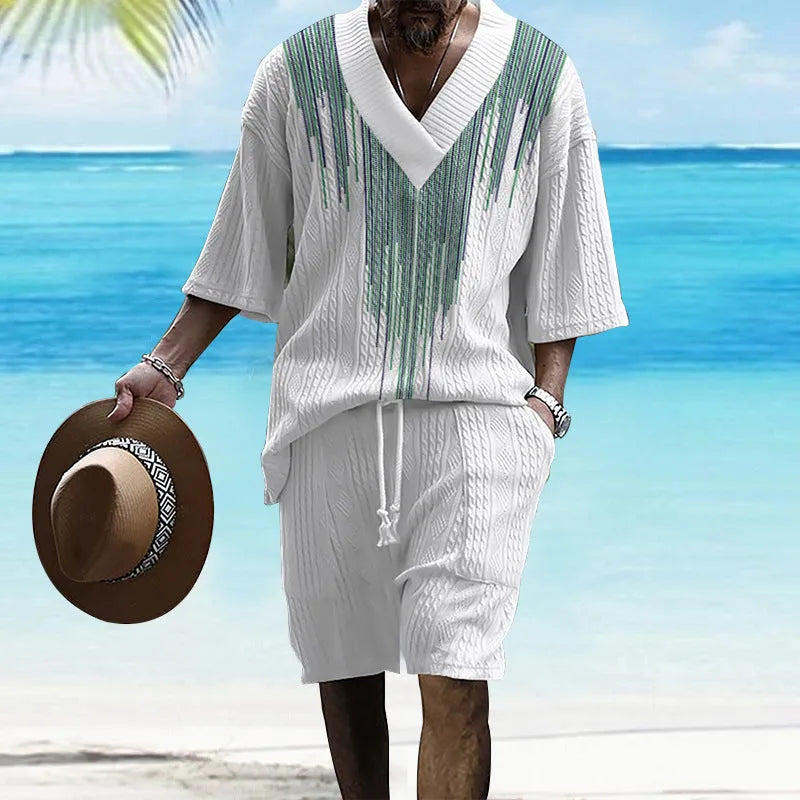 Man wearing a printed drop-shoulder knitted short sleeve top with matching shorts, a casual two-piece loungewear set.