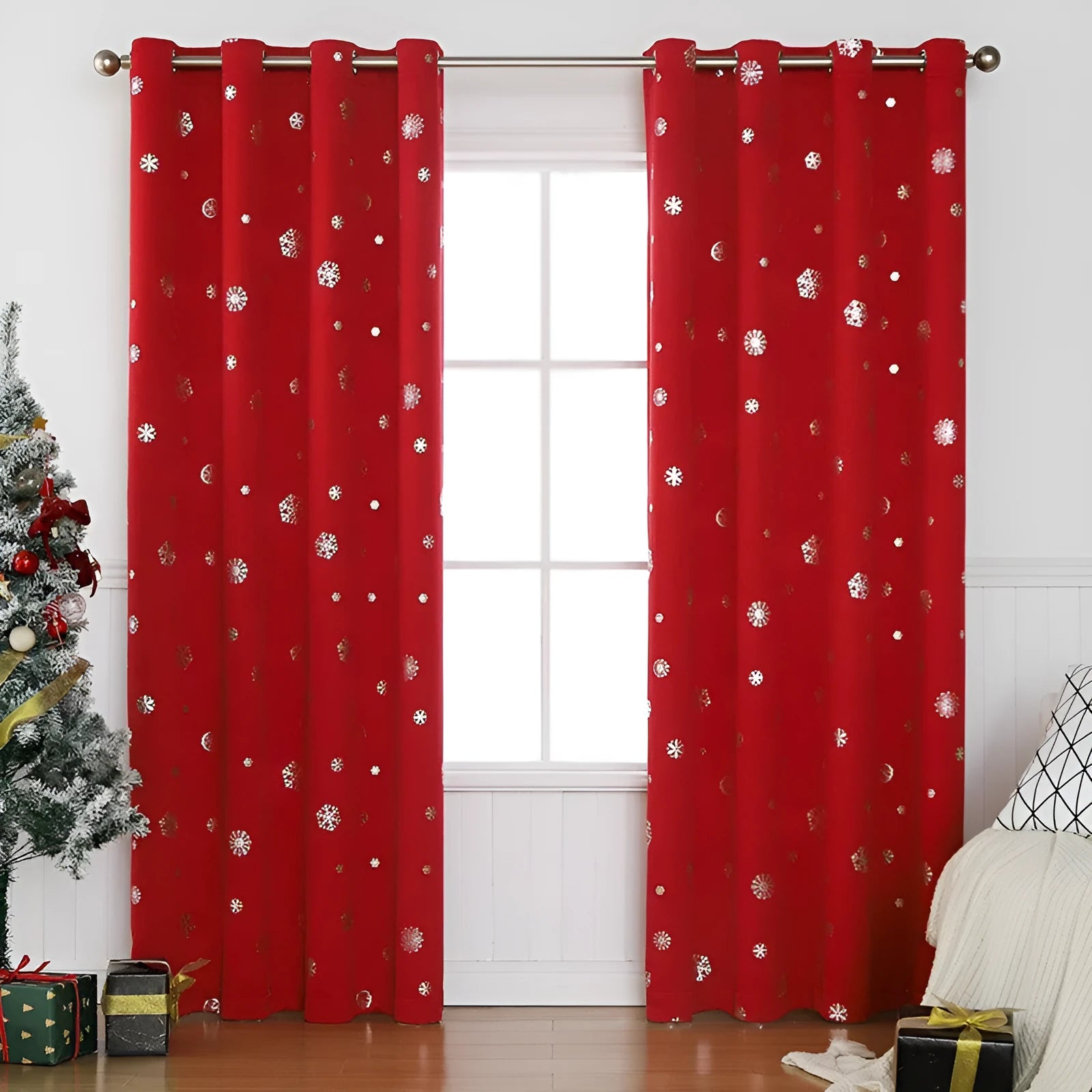 Red snowflake pattern shade cloth curtain with lace loops hanging against window