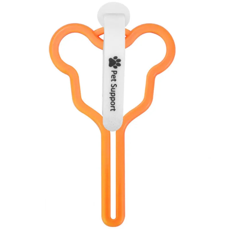 Dog waste bag holder with hands-free clip and Velcro strap attached to a dog leash