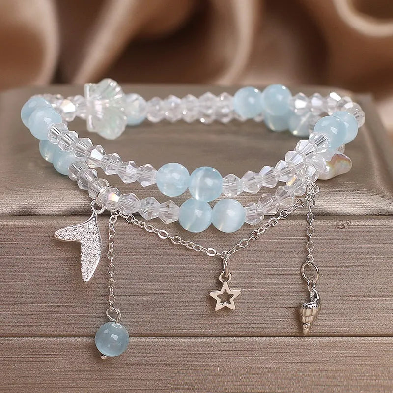 Light blue double circle aquamarine bracelet for women with two interlocking rings.