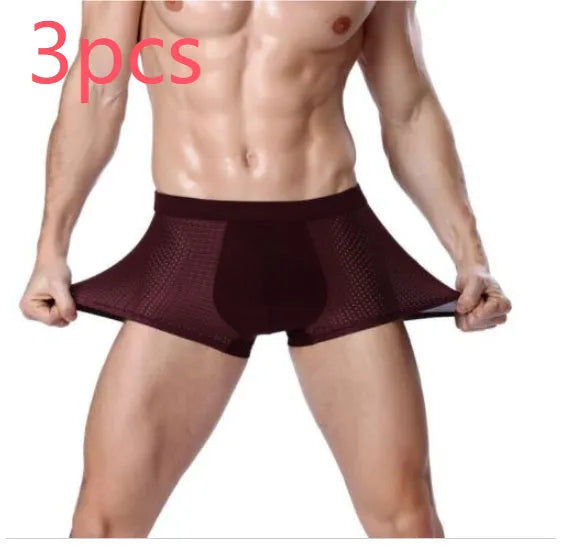 Men's solid colour ice silk modal boxer briefs with U convex design on a white background.