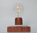 Magnetic levitation floating light bulb on an imitation wood base with multiple international plug options