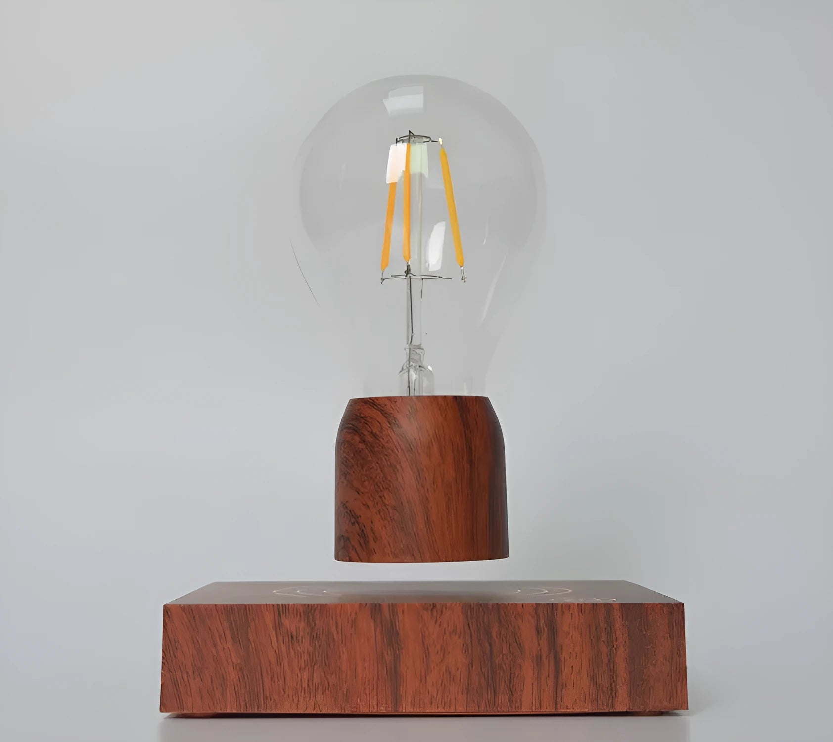 Magnetic levitation floating light bulb on an imitation wood base with multiple international plug options