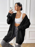 Women's dark green acrylic cardigan sweater with two pockets and long sleeves.