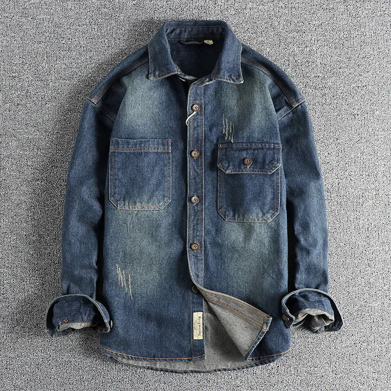 Man wearing a light blue loose-fit vintage denim shirt with long sleeves, cardigan style.