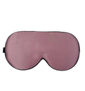 Double-sided Mulberry silk sleep eye mask showing embroidered detail, in a selection of colours on a neutral background.