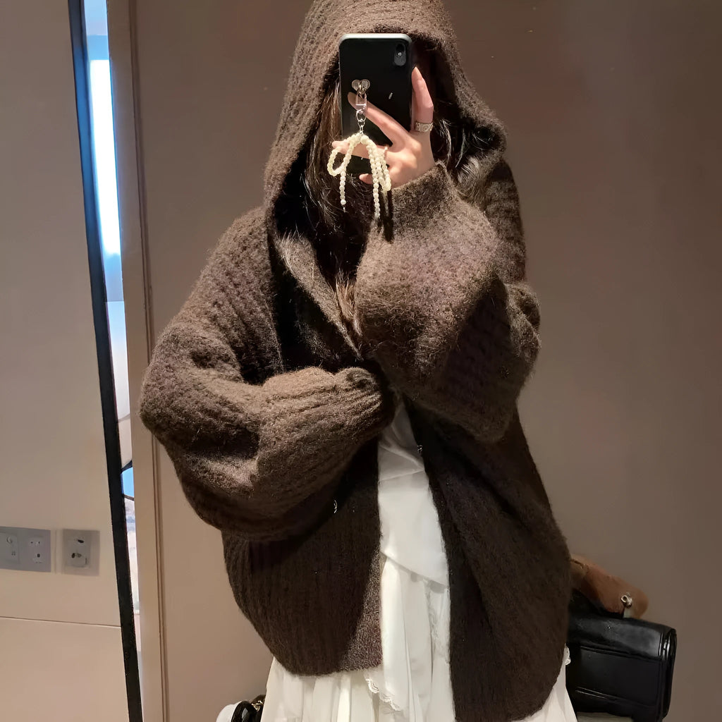 A loose-fit, thick acrylic hooded cardigan sweater for women, shown in a macaron colour.
