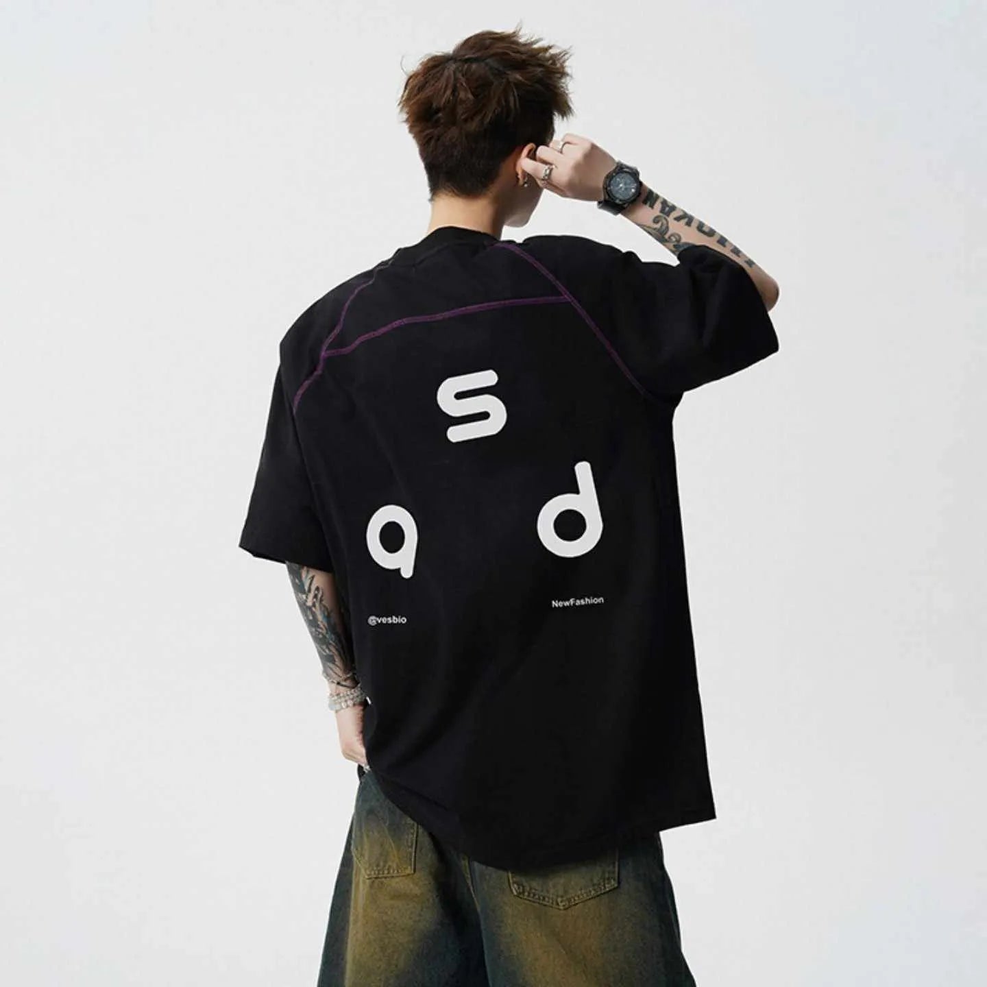 Men's black cotton t-shirt with white letter print, short sleeves, and a round neck.