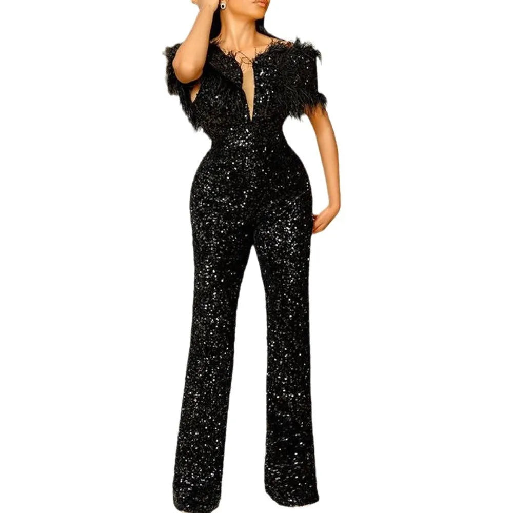 Black slim fit women's jumpsuit with feather and sequin detail, mid waist and three-quarter sleeves.
