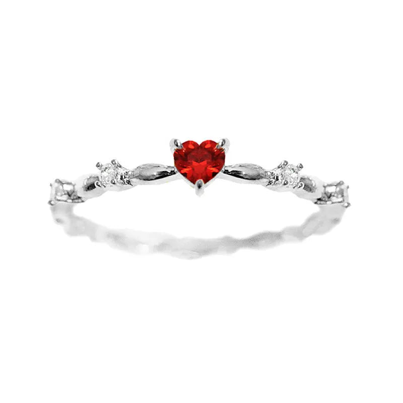 Zircon peach heart ring in gold or silver electroplated finish on copper, shown in UK sizes 6-10