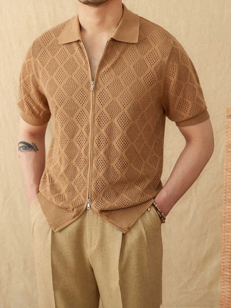 Light brown cotton cardigan top with lapel collar, short sleeves, and a centre front zipper on a hanger.